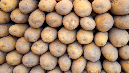 Close- up fresh potatoes in the bazaar 