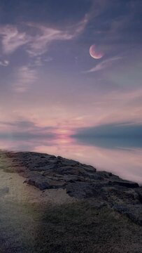 Vertical video of moon over the sea