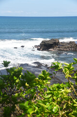Seascapes at south cost in Bali island of Indonesia,with rock formation and big wave