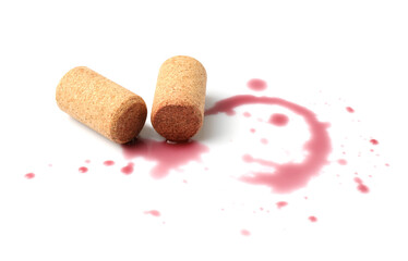 Bottle corks with wine stains on white background
