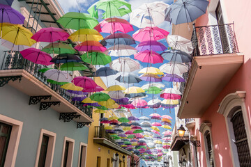 colorful umbrellas on Calle Fortaleza in puerto rico © Kaitlind