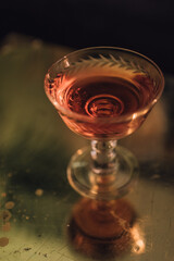 pink rose wine in a vintage champagne coupe