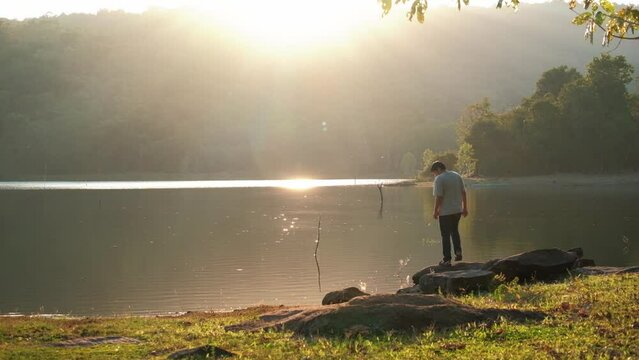 Viewpoint of Phu Pha Daen Forest Park During the sunset, there are men walking to admire the atmosphere of the water source.
