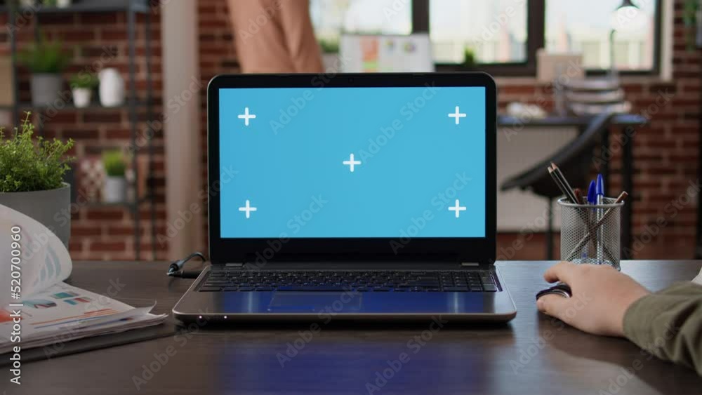 Poster pov of startup manager typing on laptop with greenscreen in brick wall office. using isolated copysp