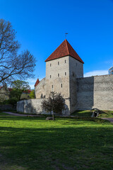 Fototapeta na wymiar Medieval tower and fortress walls of Old Town Tallinn