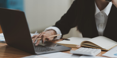 Business woman analyze the company's financial results and budget. Account Audit Concept.