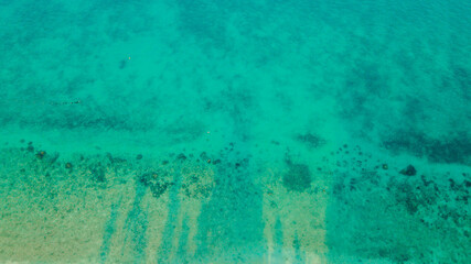 Aerial drone view of turquoise sea water scenery at Besar Island or Pulau Besar in Mersing, Johor, Malaysia