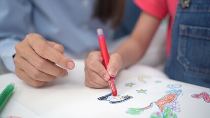 Asian young elementary school age enjoy learning and playing in their classroom