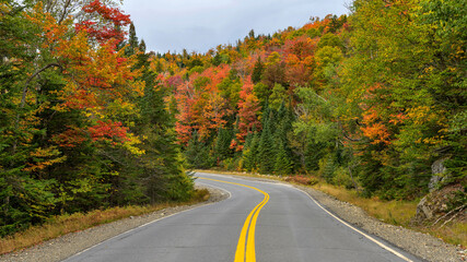 Winding Autumn Road - A wide-angle view of Highway Route 17, part of Rangeley Lake Scenic Byway,...