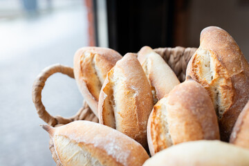 Ready-made La Ciriola romana bread on the counter at the artisan bakery. Front view.