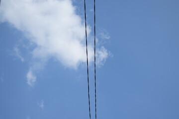 transverse cable against sky clouds background