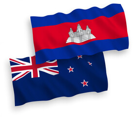 National vector fabric wave flags of New Zealand and Kingdom of Cambodia isolated on white background. 1 to 2 proportion.