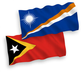National vector fabric wave flags of Republic of the Marshall Islands and East Timor isolated on white background. 1 to 2 proportion.