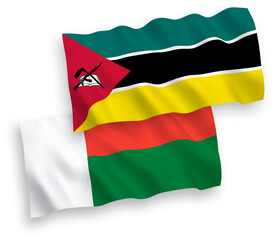 National vector fabric wave flags of Republic of Mozambique and Madagascar isolated on white background. 1 to 2 proportion.