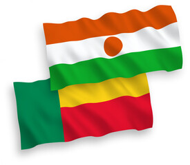 National vector fabric wave flags of Republic of the Niger and Benin isolated on white background. 1 to 2 proportion.