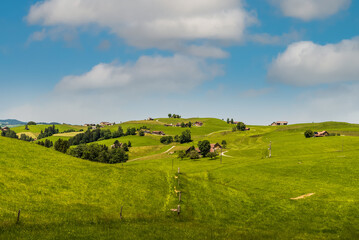 Mountain landscape with farmhouses and pastures in Appenzellerland, Switzerland