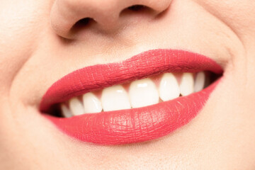 Beautiful red lips close up diagonally.