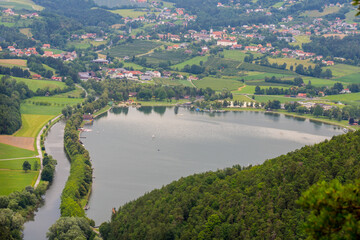 wonderful lake in the green nature with houses above