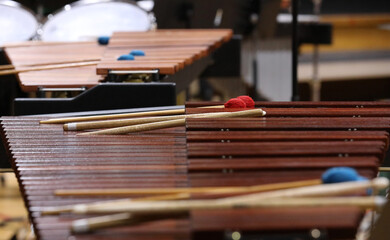 A close up of a xylophone or marimba showing the tuned wooden slats and mallets used to make the sound. Music, percussion and orchestral concept.