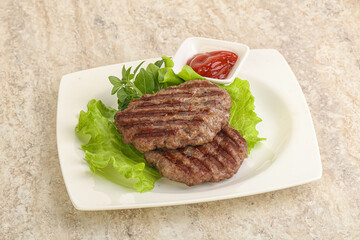 Grilled beef burger cutlet with sauce