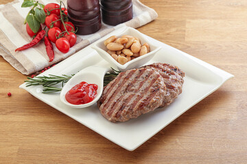 Grilled beef burger cutlet with sauce