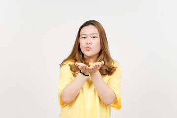 Blowing Kiss of Beautiful Asian Woman wearing yellow T-Shirt Isolated On White Background