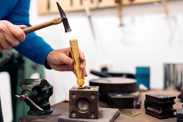 Fototapeta premium Using Hammer in Jewelry Atelier