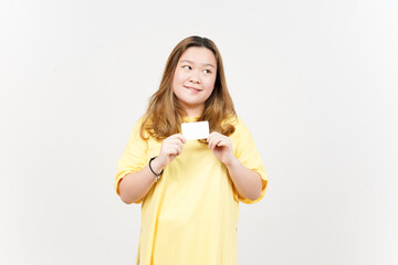 Holding Blank Bank Card Or Credit Card of Beautiful Asian Woman wearing yellow T-Shirt