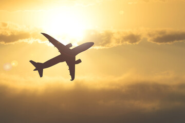 Silhouette of a passenger plane in the sky. Travel and travel ideas around the world.