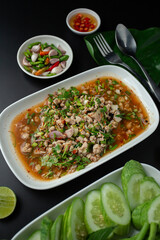 Northeastern Thailand's food, spicy minced pork salad(Larb Moo) is spicy and hot. Serve with fresh vegetables
