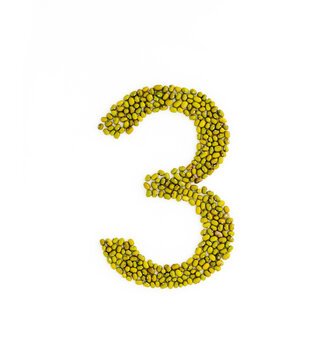 Number 3 made from mung beans. Green mung bean font. Alphabet made from green gram . White background. Dry green maash seeds.