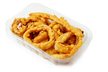 Onion rings in a plastic tray on white background. Simple food with high calorie and fat count. Beer snack.
