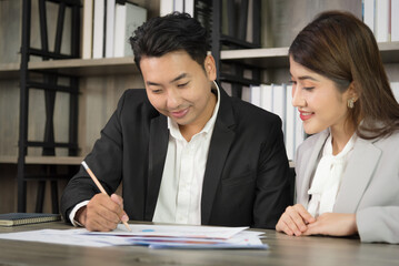 Business Asian people in formal outfit working together and brainstorming in modern office workplace.
