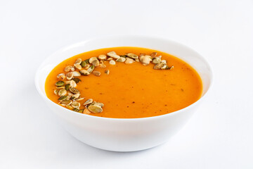 pumpkin cream soup on white