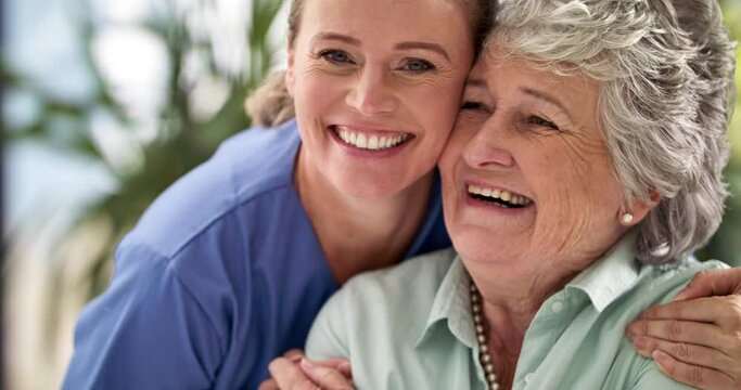 Kind medical nurse care and support with elderly patient. Senior woman with big happy smile after hearing good news from doctor. Healthcare professional with happy old lady in a hospital.