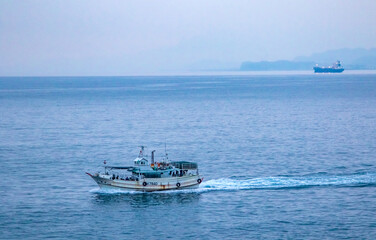 Fototapeta premium Fishing vessel in the sea near Yeh Liu, Taiwan