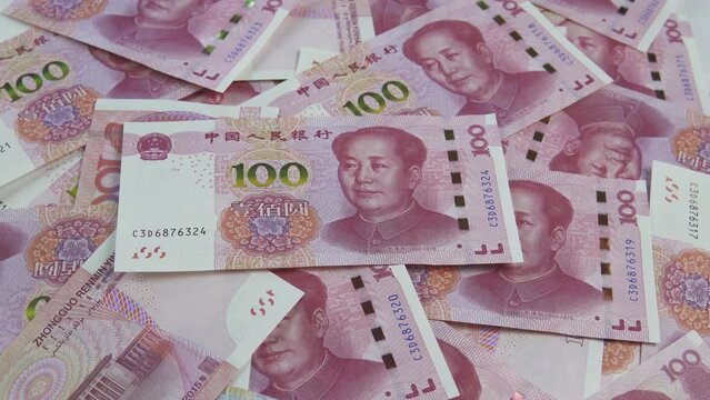 China yuan - rotating background. Chinese trade. Business and Finance concepts.