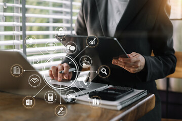 Business concepts, business people working in the work area with tablet and laptop and data sheets at the desk.