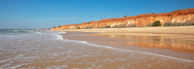 Summer portugal beach and red cliff- Algarve