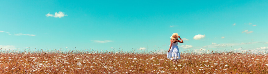 woman in field panorama view