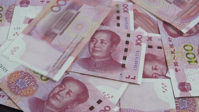 China yuan falling, couting - rotating background. Chinese trade. Business and Finance concepts.