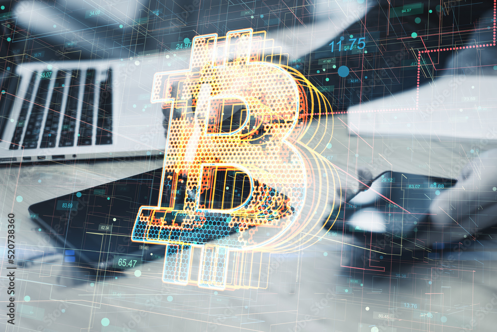 Poster close up of businessman hands using tablet and smartphone on desktop with creative glowing bitcoin h
