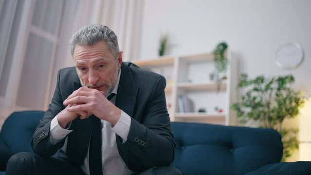 Senior man having financial problems, creditors trouble, unhappy with his life