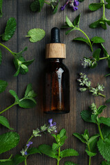 Concept of aromatherapy with mint on wooden background