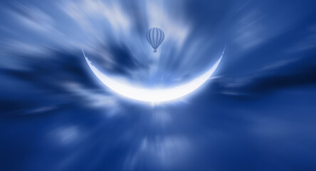 Hot air balloon flies through the clouds and crescent moon