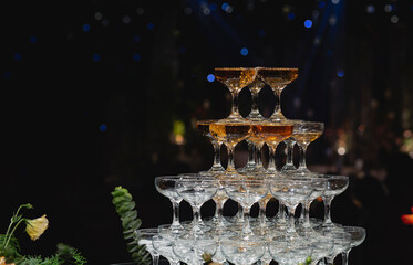 a glass of champagne on table top. 