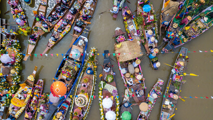 Aerial view floating festival in Thailand, People enjoy the candle procession in the river...
