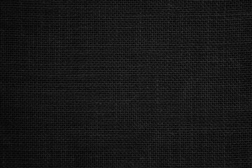 Fototapeta na wymiar Black hemp rope texture background. Haircloth wale black dark cloth wallpaper. Rustic sackcloth canvas fabric texture in natural. 