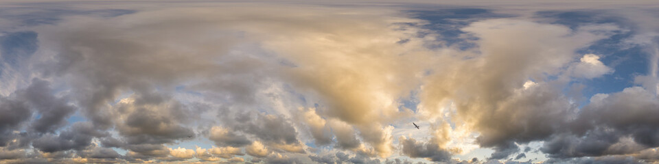 Dramatic sunset sky panorama with Cumulus clouds. Seamless hdr 360 pano in spherical...