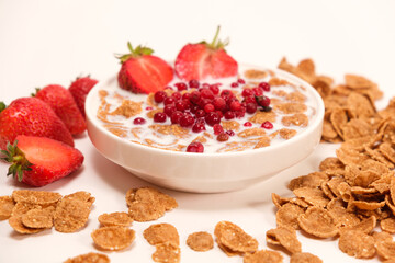 Cereals drenched in milk - quick breakfast with fruits and berries